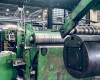 Cutting center for transverse and longitudinal cutting of coiled